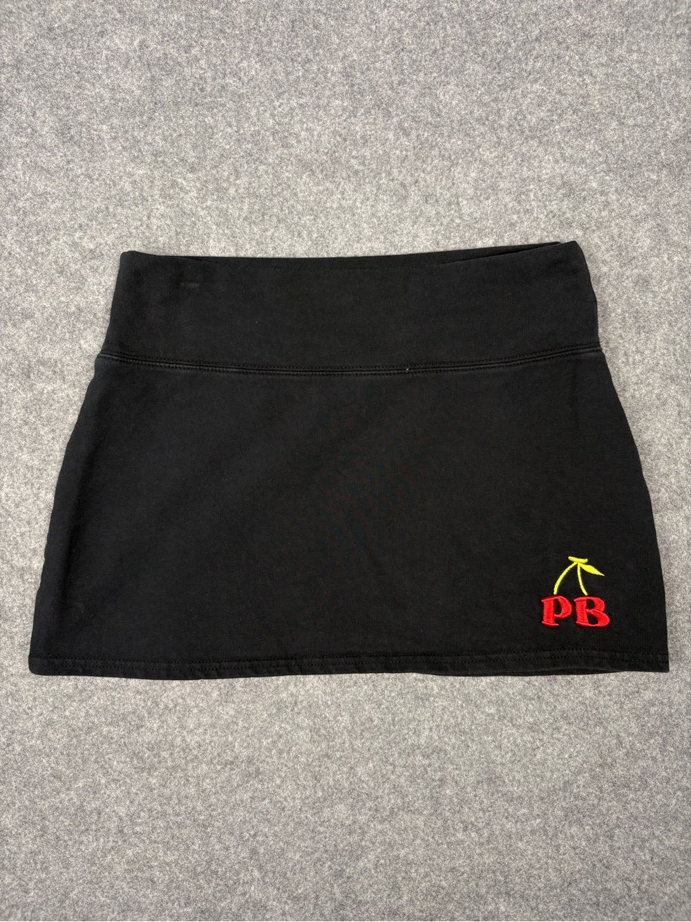 PacSun Black Mini Skirt with Red PB Cherry Accent